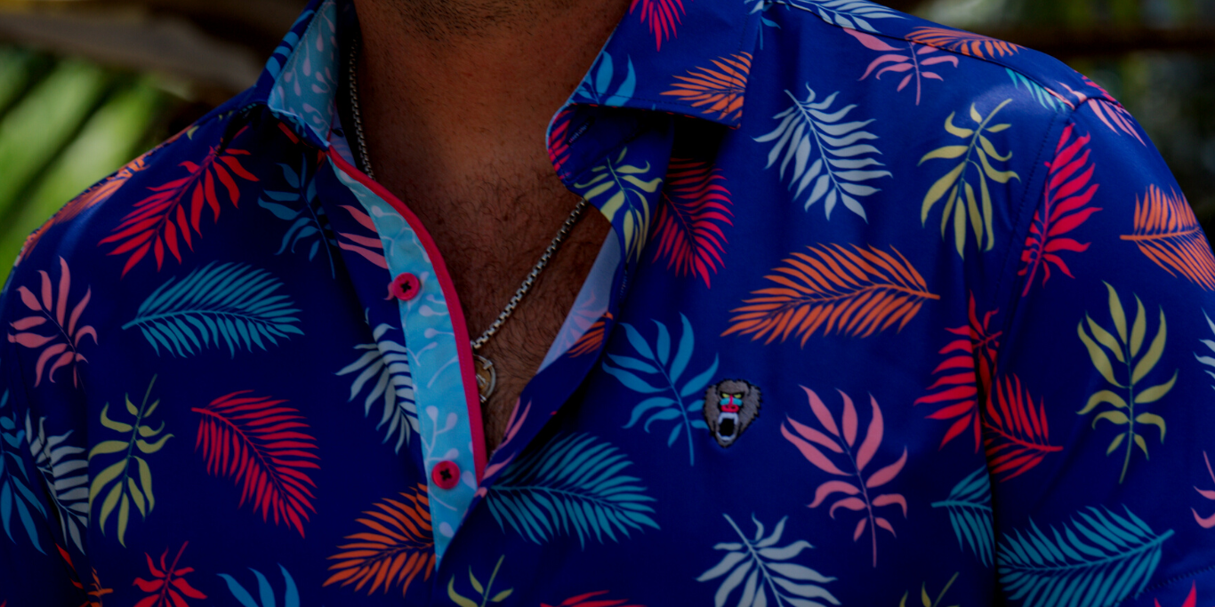 A man wearing Mad Chuck polo with variety of colors.