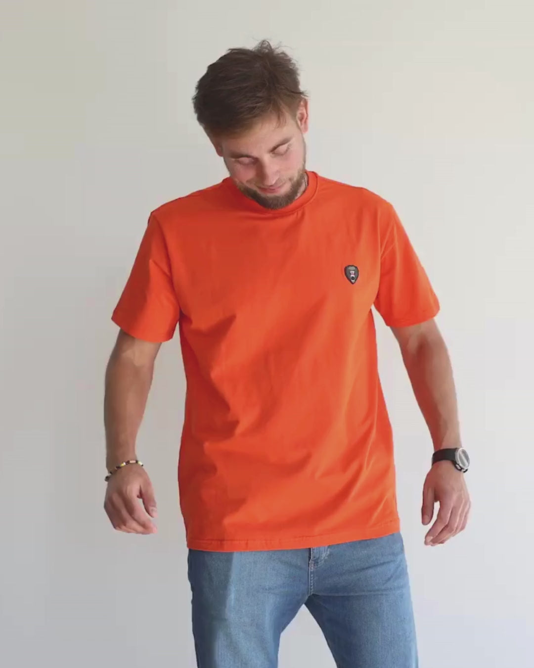A model wearing Orange Mad Chuck Shirt